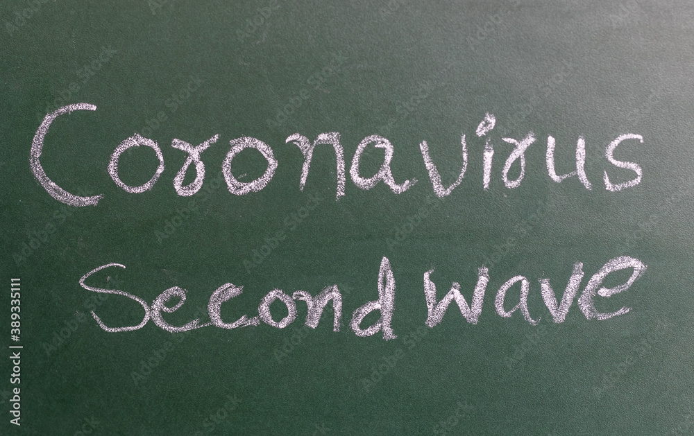 Obraz premium Coronavirus Second Wave on black board written with chalk.