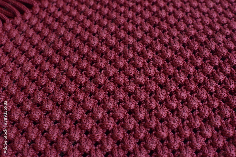 the texture of the knitted fabric is dark red the texture of the knitted fabric is dark red