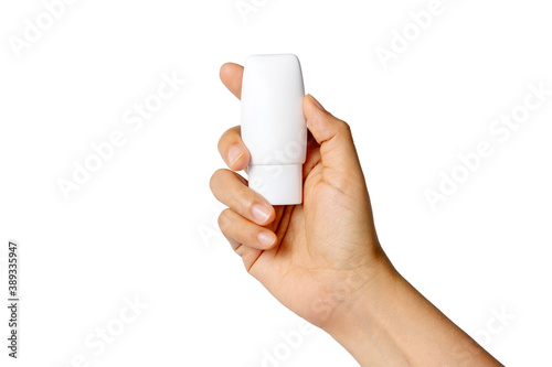 Close up of female hand hold white lotion bottle isolated on white background