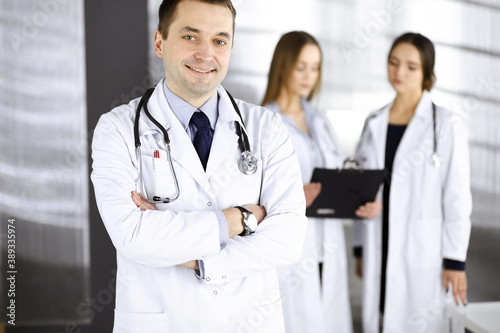 Professional middle aged doctor with a stethoscope and crossed arms at work in a clinic. Perfect medical service in a hospital. Medicine and healthcare concept