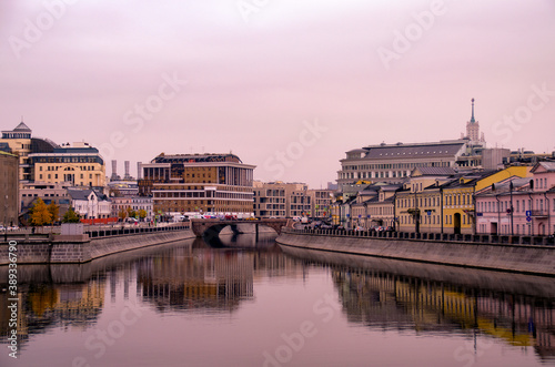 View of the panorama of the city of Moscow from the Crimean embankment. Walking along the river on the pavement in cloudy autumn weather. © t.karnash