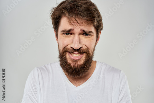 emotional bearded man close-up facial expression studio lifestyle