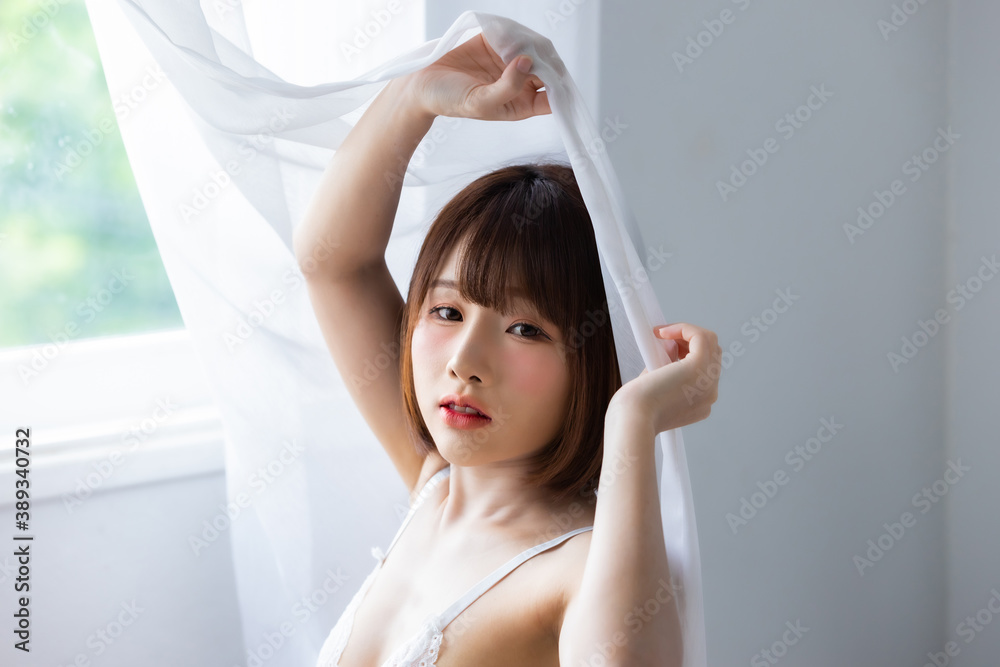 Portrait asian young woman wearing sexy bikini in bedroom Portrait asian young woman wearing sexy bikini in bedroom