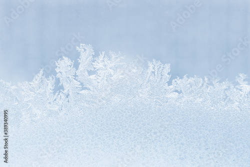 Light frosty pattern on the glass (background, texture)