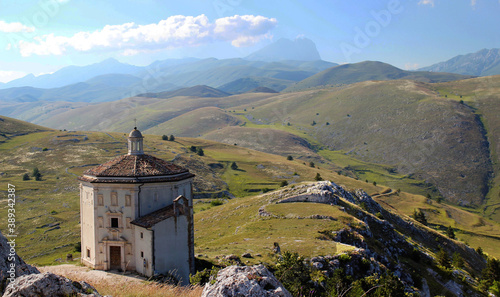 Paisaje de montaña con iglesia abandonada en primer plano. Apeninos, Italia photo