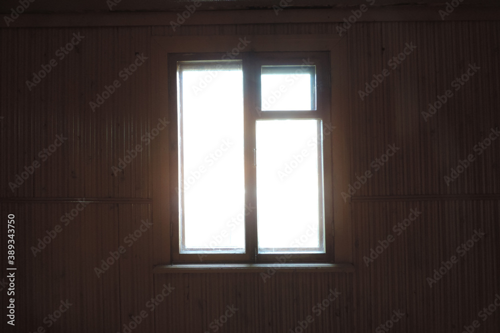 slightly blurry view of dark empty room and light window , sunlight shining through window of old country house, dark empty room slightly blurry view of dark empty room and light window , sunlight shining through window of old country house, dark empty room