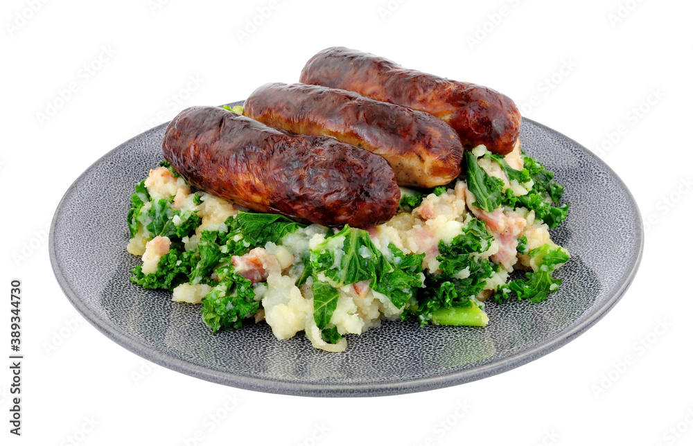 Traditional Irish Colcannon and sausage meal, Colcannon is made with mashed potato and kale or cabbage, isolated on a white background Traditional Irish Colcannon and sausage meal, Colcannon is made with mashed potato and kale or cabbage, isolated on a white background