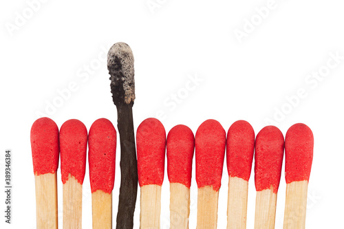 red match sticks with a burnt one in the middle