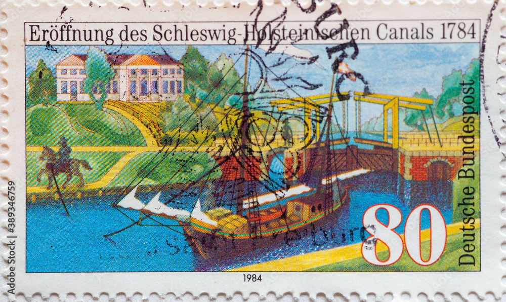 GERMANY - CIRCA 1984 a postage stamp from Germany, showing an antique cargo sailor with lock and Knoop manor. 200 years of the Eider Canal in Schleswig-Holstein