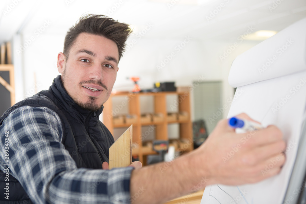 young architect working at drawing board thinking young architect working at drawing board thinking