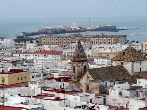 General view of the Castle and Lighthouse of San sebastian, Cadiz, from one of the viewpoint towers that the city has