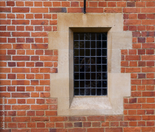 Architectural feature showing old fashioned window embedded in brick wall