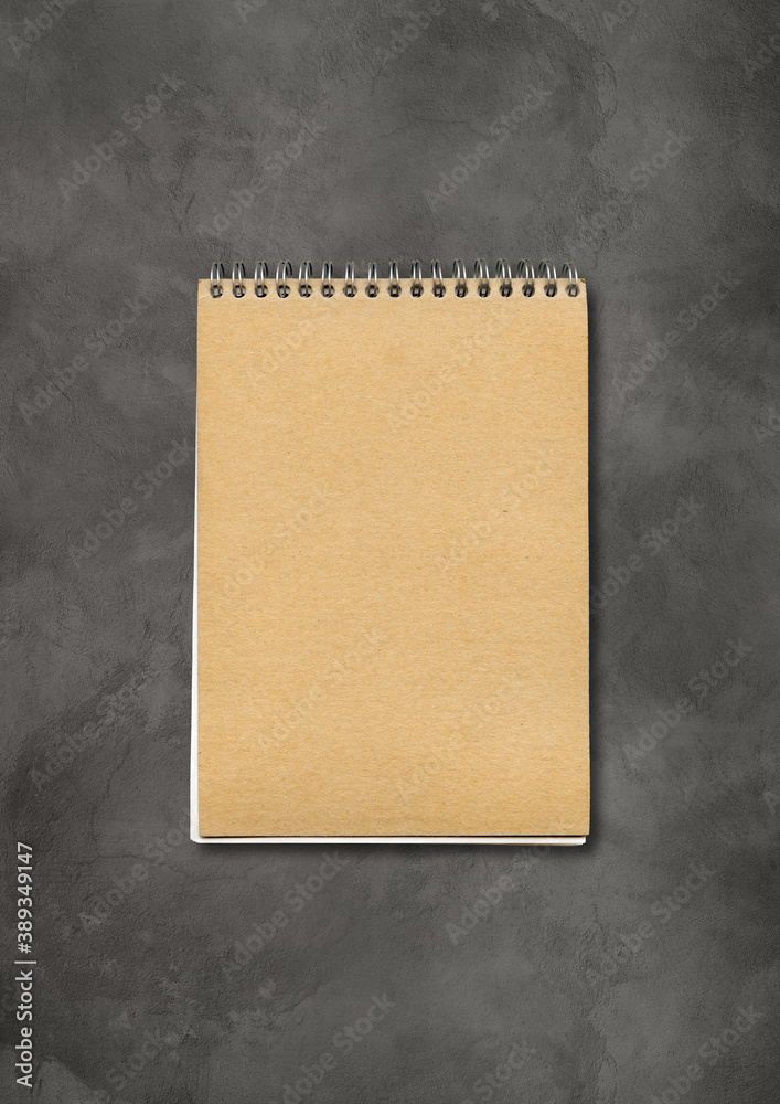 Spiral closed notebook mockup on concrete background Spiral closed notebook mockup on concrete background