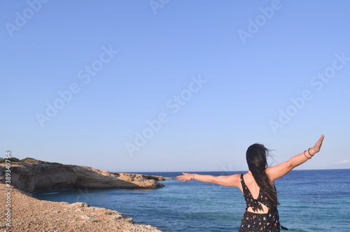 Girl looking at the sea in Greece