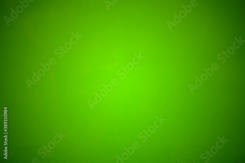 Bright green concrete texture adjusts border, dark image for the background, abstract decorative stucco wall background for designer, dark green background, vintage faded green background.