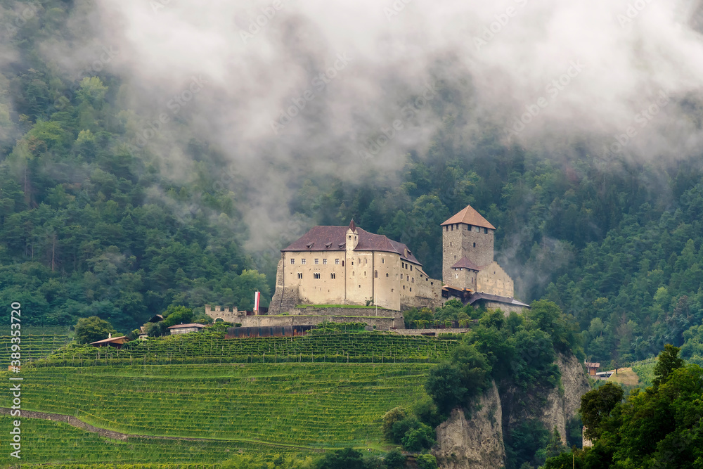 View of Tyrol Castle, Schloss Tirol in German, with a low cloud in the background, Merano, South Tyrol, Italy