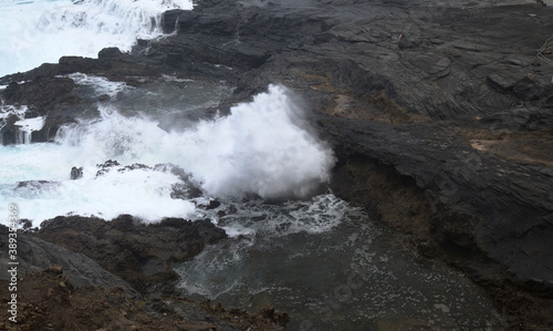 North coast of Gran Canaria, lava fields of Banaderos area, grey textured lava from eruption of Montana de Arucas, 
stormy weather in October photo