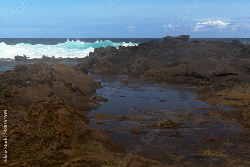 North coast of Gran Canaria, lava fields of Banaderos area, grey textured lava from eruption of Montana de Arucas, 
stormy weather in October photo