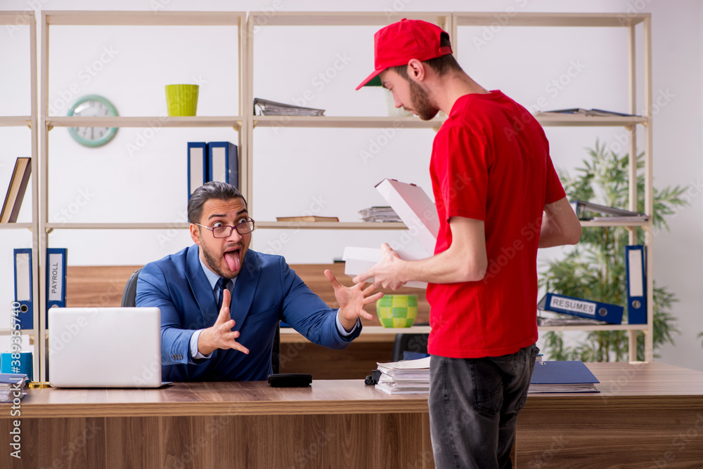 Young man delivering pizza to the office