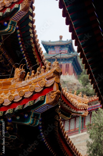 Historic architecture of China in Summer Palace, Bejing - roofs and decorations