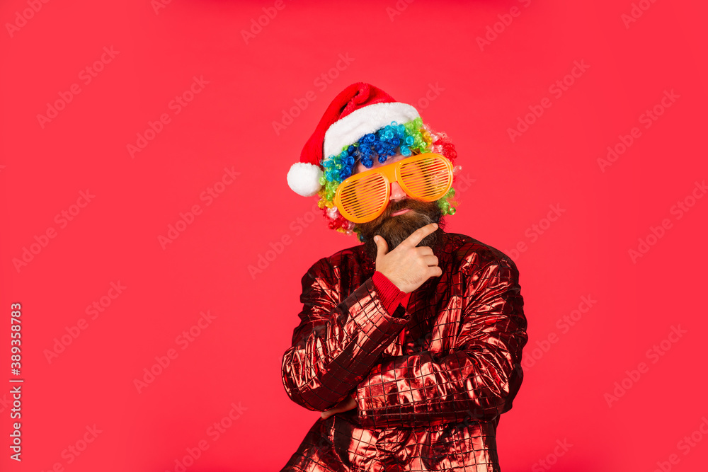 surprise for xmas holiday. new year party. mature and brutal hipster in santa claus hat. serious bearded man in party glasses. its christmas time. gifts and presents preparation. copy space surprise for xmas holiday. new year party. mature and brutal hipster in santa claus hat. serious bearded man in party glasses. its christmas time. gifts and presents preparation. copy space