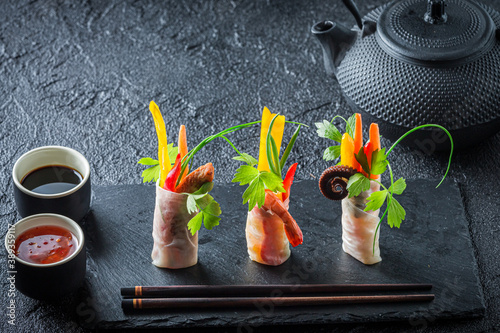 Tasty spring rolls served w...