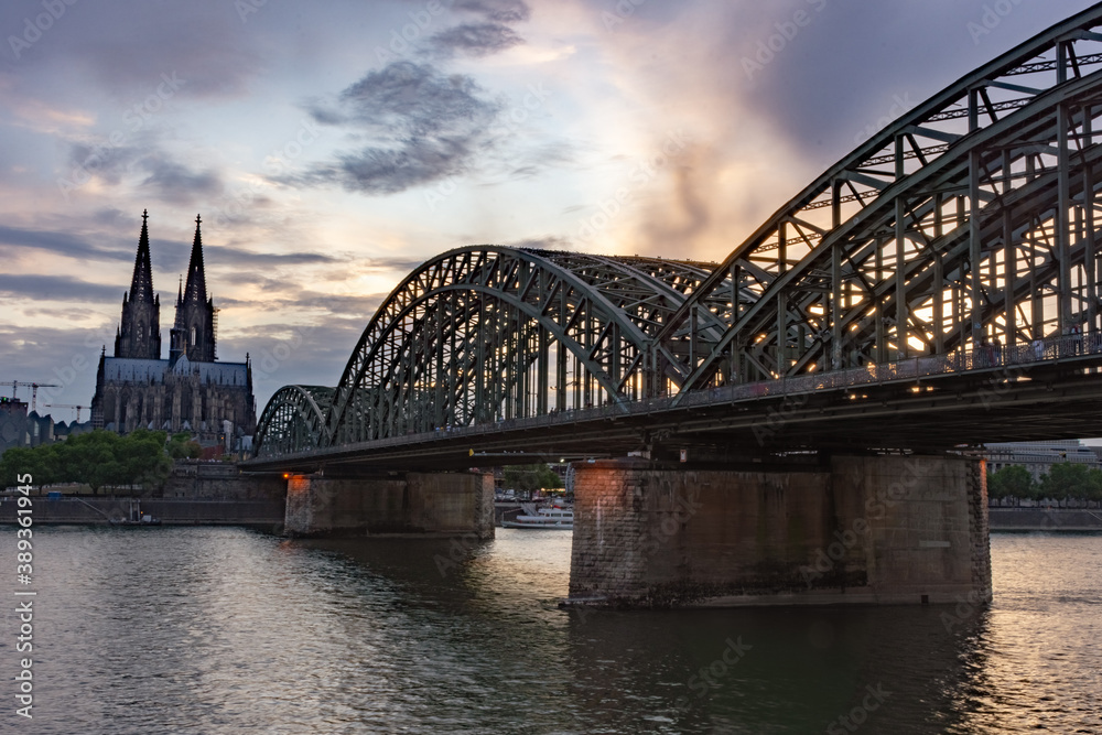 Naklejka premium Cologne Cathedral and Hohenzollern Bridge at twilight, Germany