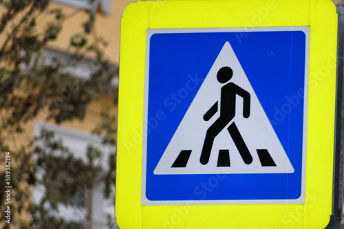Road sign of a pedestrian crossing in close-up