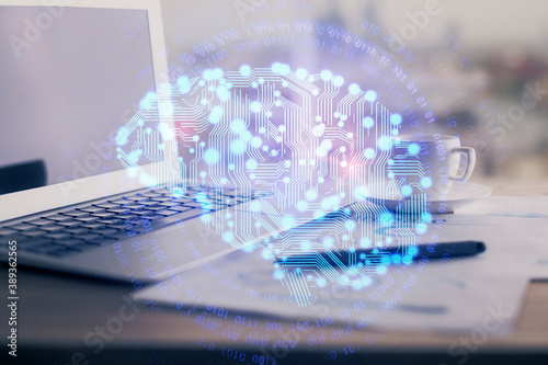 Double exposure of desktop with computer and brain drawing hologram. Artificial intelligence concept. © peshkova
