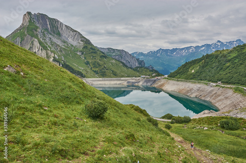 Hiking through the mountains in Vorarlberg, Austria. Hiking along the Lechweg in Austria. Hiking through a lonely mountain landscape in Austria. Hiking towards a mountain lake in Austria.