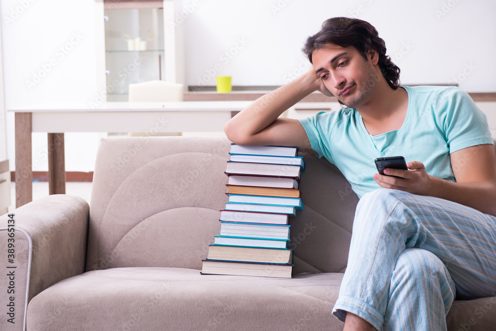Young male student unhappy with excessive work at home Young male student unhappy with excessive work at home
