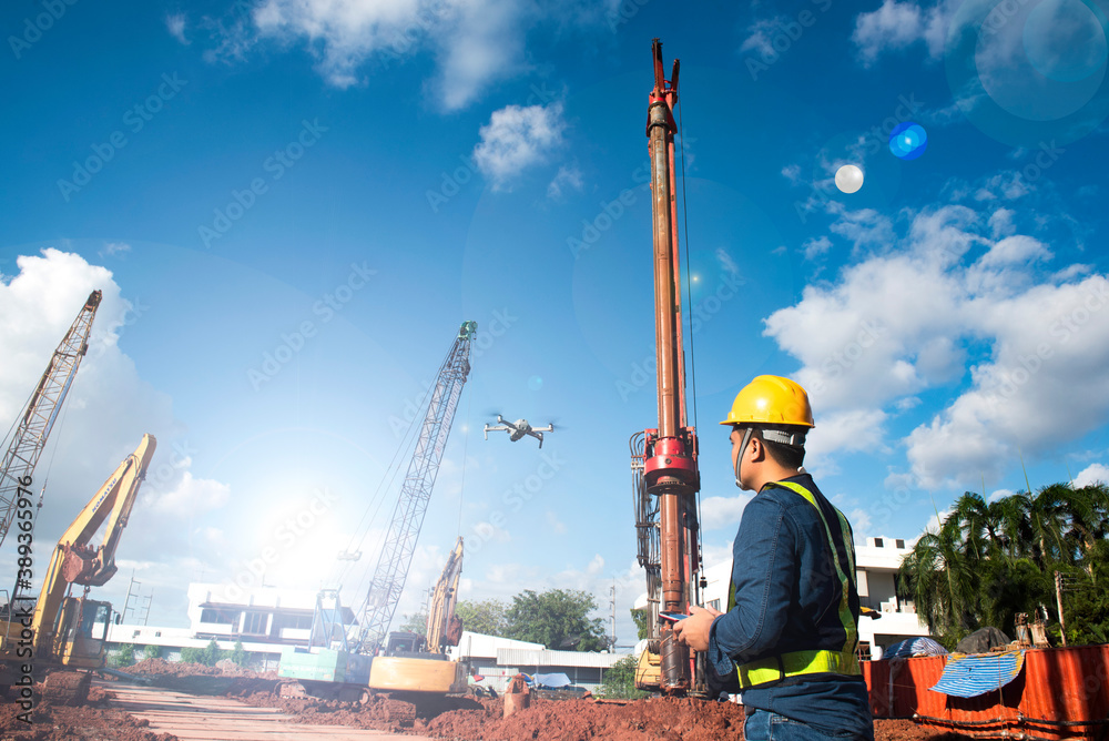 Drones are operated by construction workers on construction sites on large scale jobs. Drones are operated by construction workers on construction sites on large scale jobs.