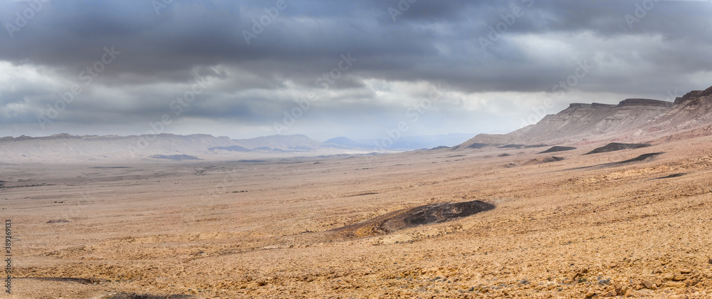 Deserted rocky canyon under the stormy cloudy sky, multi-shot panorama. Deserted rocky canyon under the stormy cloudy sky, multi-shot panorama.