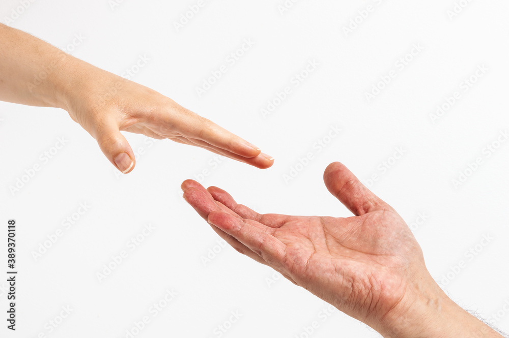 Women's hand goes to the man's hand on white background Women's hand goes to the man's hand on white background