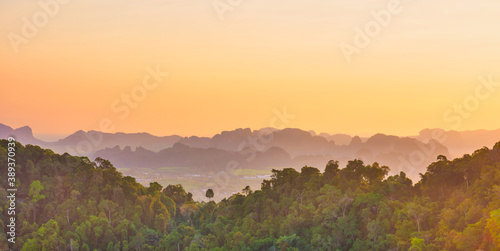 Beautiful tropical landscape with mountain rainforest and steep rocky ridge at horizon at sunset. Krabi  Thailand