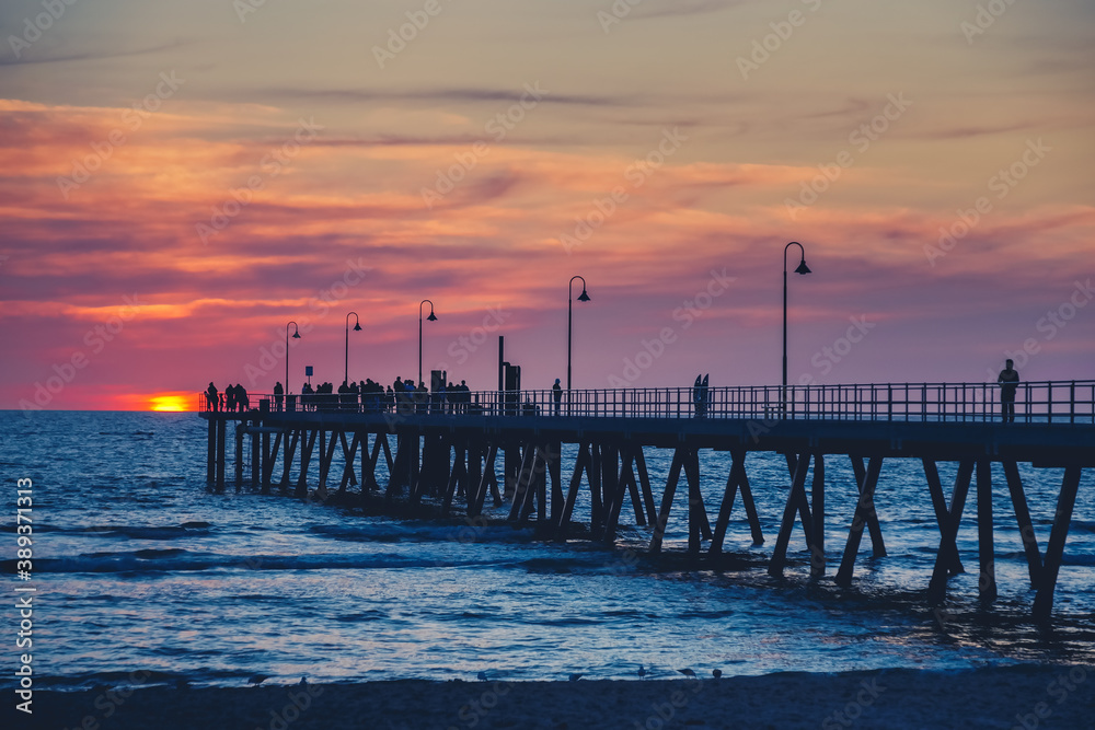 Glenelg Jetty with people at sunset, South Australia