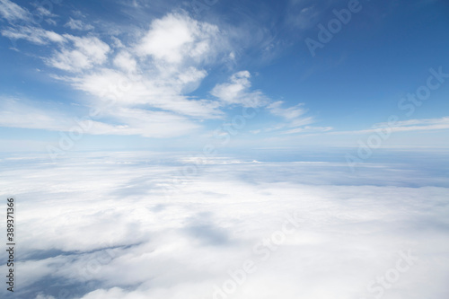 Flying above clouds, heaven and Earth concept