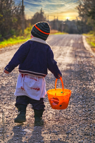 A three year old boy picks apples and goes out for Halloween in a rural area of Ontario Canada during the pandemic of 2020.  The little boy decided to dress as a zombie.