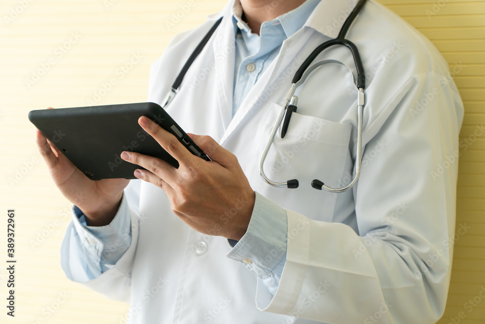 Young Asian doctors using tablets to check data and information for the health examination of patients. Concept of digital, technology and communication for medical. Young Asian doctors using tablets to check data and information for the health examination of patients. Concept of digital, technology and communication for medical.