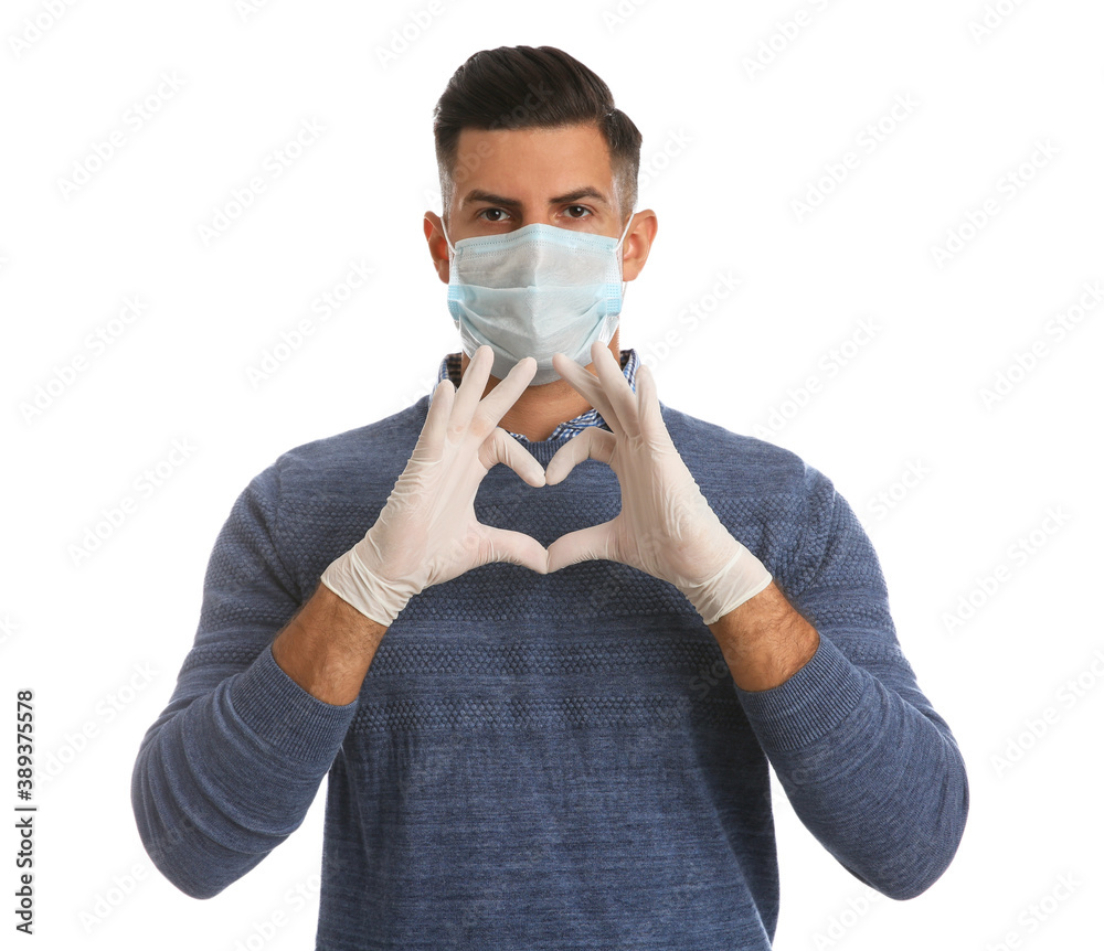Man in protective face mask and medical gloves making heart with hands on white background Man in protective face mask and medical gloves making heart with hands on white background