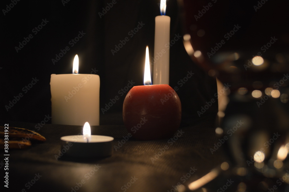 Group of burning candles and mulled wine Group of burning candles and mulled wine