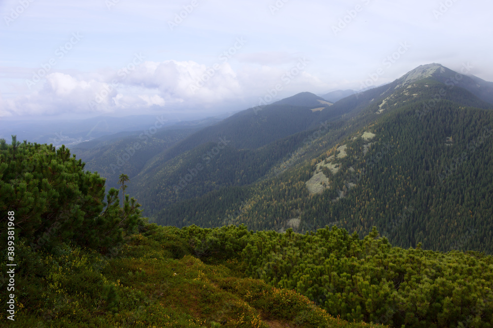 View from the mountain peak, beautiful nature landscape. Tourism, travel, climbing, hiking, active leisure concept