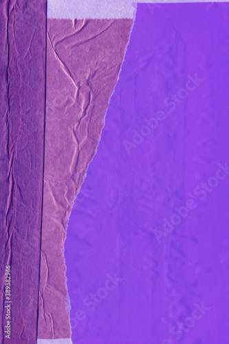 Blue and violet torn paper collage close-up. Texture made from various paper and cardboard parts. Damaged old paper background. Vintage blank wallpaper. Material design backdrop.