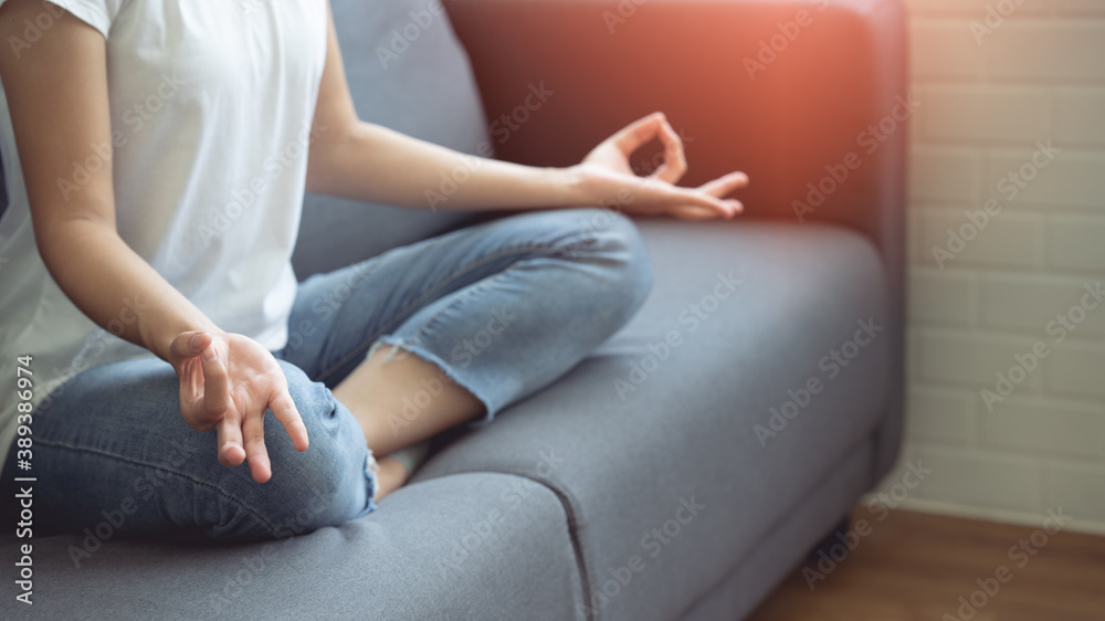 Woman sitting and doing yoga pose To relax Woman sitting and doing yoga pose To relax
