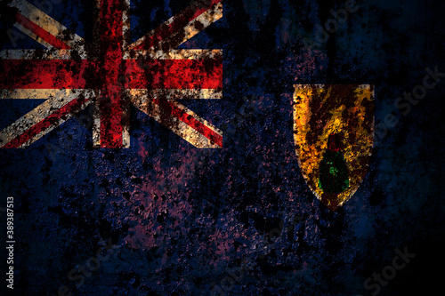 British, Britain, Turks and Caicos Islands flag on grunge metal background texture with scratches and cracks © Vlad