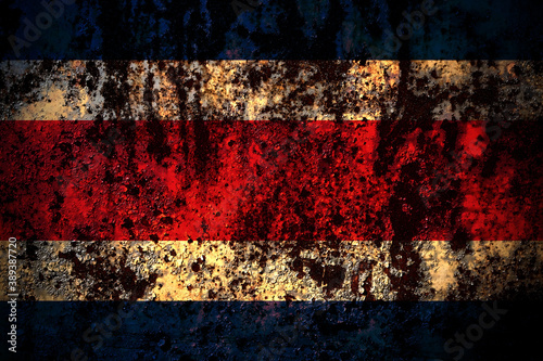 Costa Rica flag on grunge metal background texture with scratches and cracks