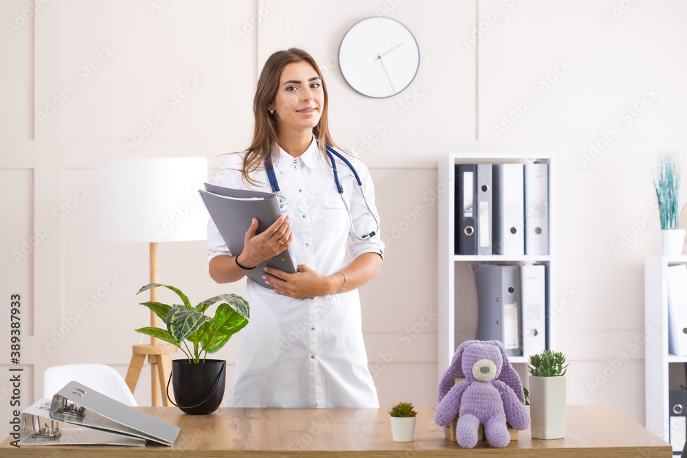 Young female doctor in a white coat Young female doctor in a white coat