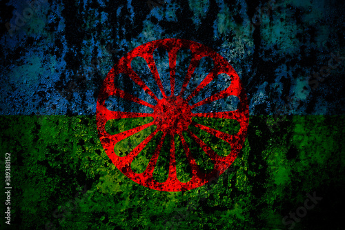 Fotografie Gipsy flag on grunge metal background texture with scratches and cracks