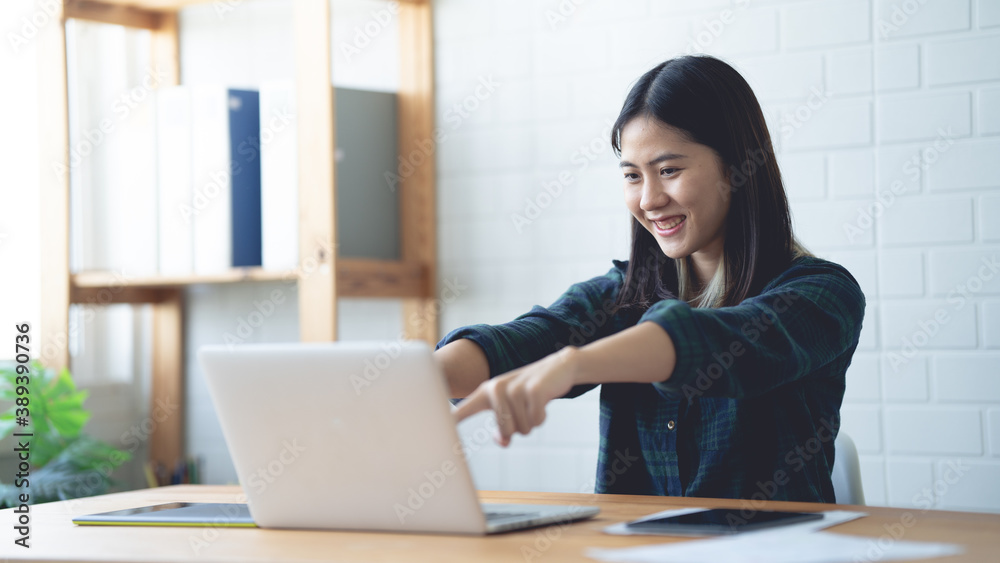 Asian women working at home using a lab. Graphic design. Working with pleasure. Concept work at home. Asian women working at home using a lab. Graphic design. Working with pleasure. Concept work at home.