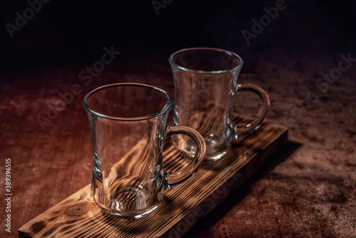 Empty glass cup for Turkish tea (armudu) with a handle on a dastarkhan